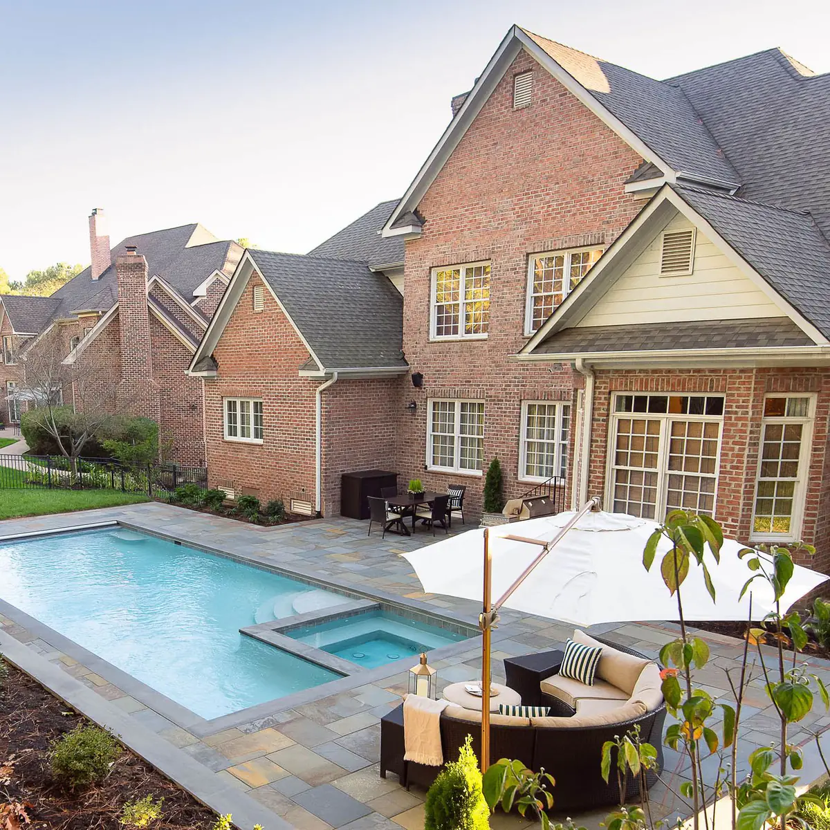Beautiful, large brick home with backyard pool and sitting area