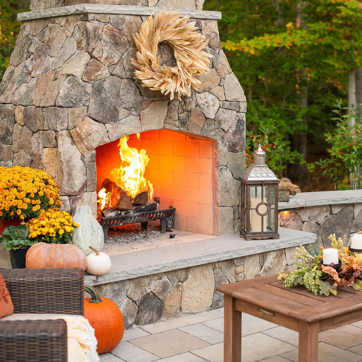 Large outdoor stone fireplace and hearth