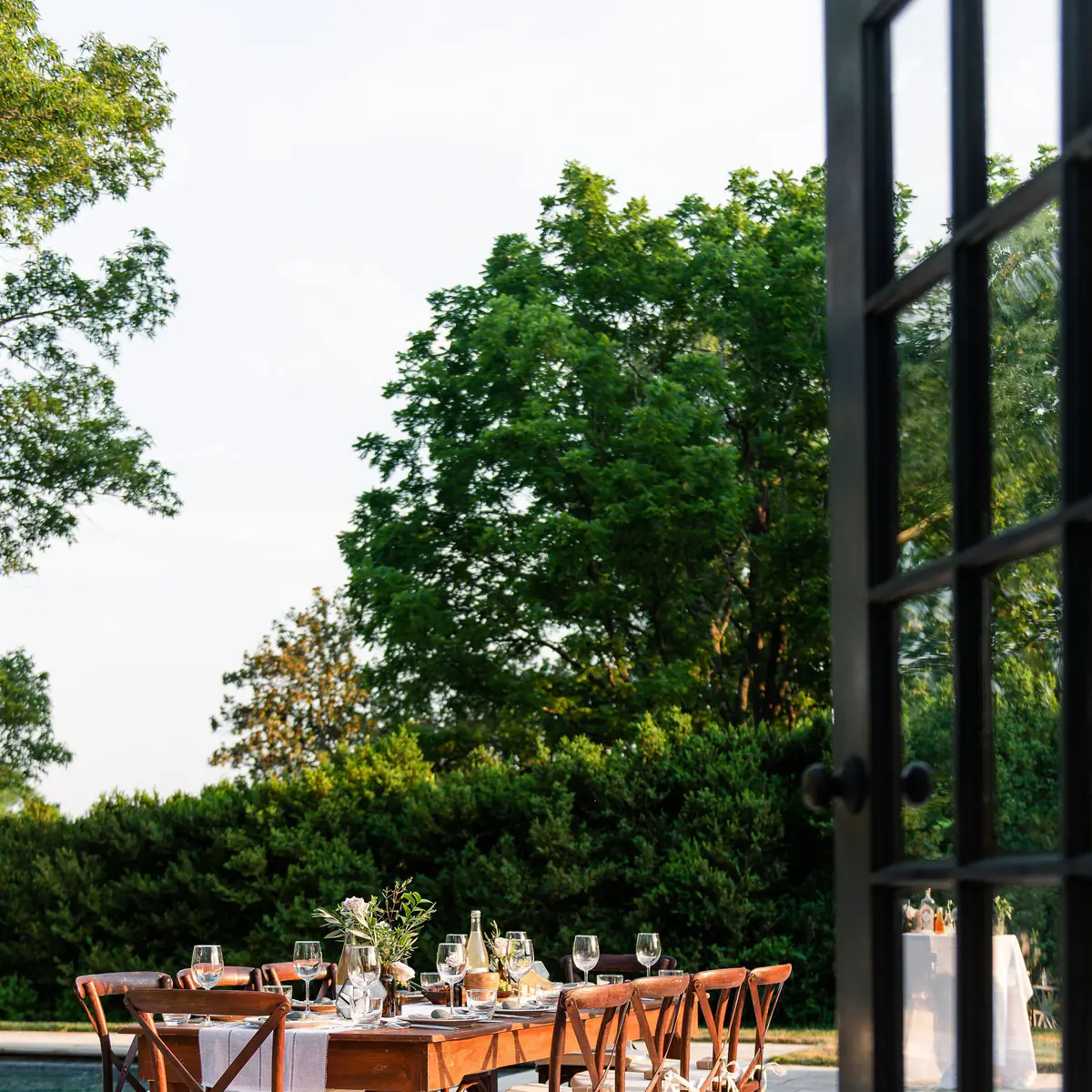 elegant poolside party on travertine pool decking