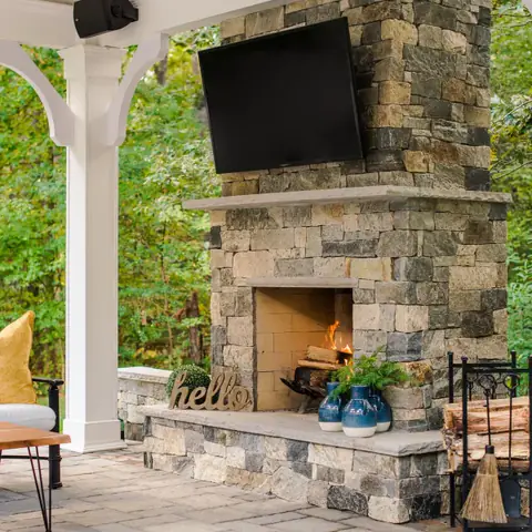 outdoor fireplace with outdoor television