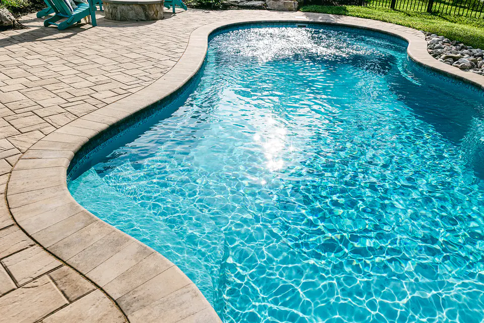 custom built luxury pool with natural stone coping